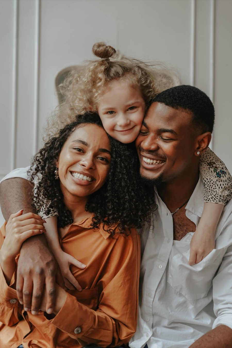 Family smiling together at home